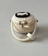 AL DOUCETTE CARVED BONE MINIAT