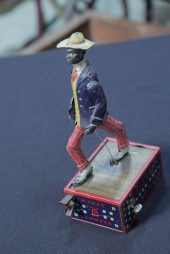 ALABAMA COON JIGGER TOY. Tin l