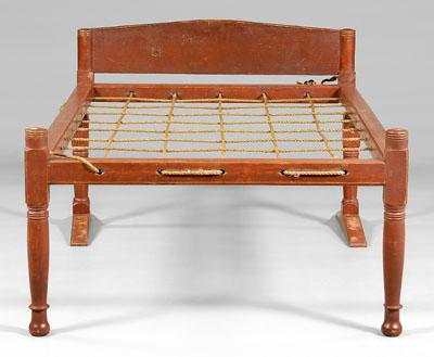 American red-painted rope bed,