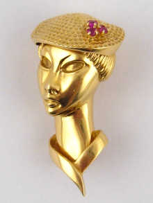 An 18 carat gold brooch by