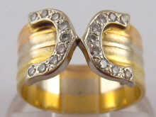 An 18 carat gold diamond ring.