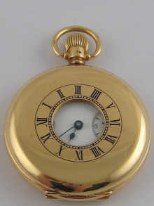 An 18 carat gold half hunter pocket