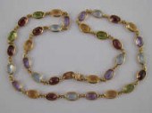 An 18 carat gold multi gem ''t