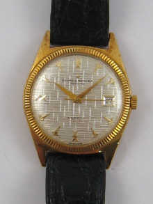 An 18 ct gold Baume & Mercier