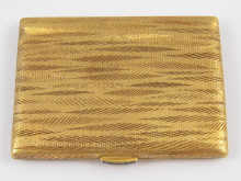 An 18 ct gold rectangular compact