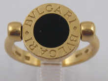 An 18 ct gold swivel top ring