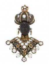 An 18 Karat Gold Diamond Cultu