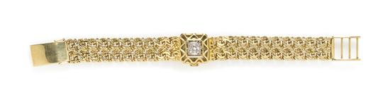 * An 18 Karat Yellow Gold and