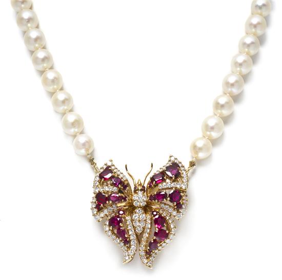 * An 18 Karat Yellow Gold Ruby