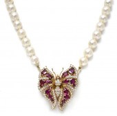 * An 18 Karat Yellow Gold Ruby
