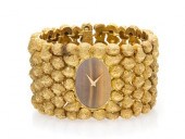 An 18 Karat Yellow Gold and Ti
