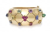 *An 18 Karat Yellow Gold and M