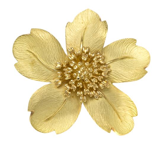 *An 18 Karat Yellow Gold Flower