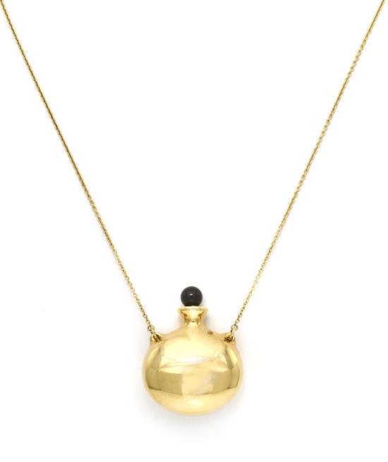 An 18 Karat Yellow Gold and Onyx