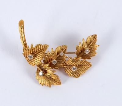 An 18ct gold and diamond leaf spray