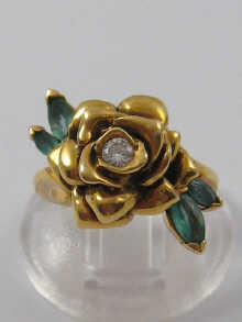 An 18ct gold diamond and emerald