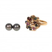 AN 18K GEMSTONE RIBBON RING &