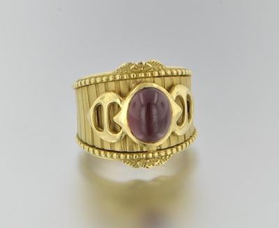 An 18k Gold and Rhodolite Garnet