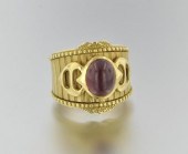 An 18k Gold and Rhodolite Garn