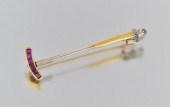 An 18k Gold and Ruby Polo Mall