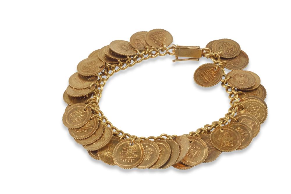 AN 18K GOLD ANTIQUE COIN BRACELETAn