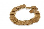 AN 18K GOLD ANTIQUE COIN BRACE