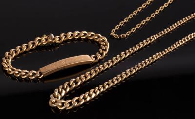 An 18k gold curb link identity