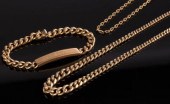 An 18k gold curb link identity
