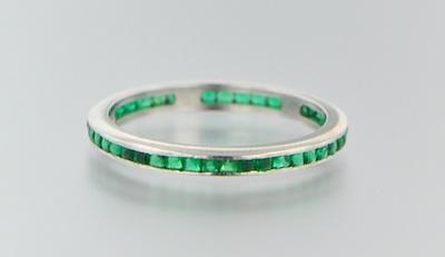 An 18k White Gold and Emerald
