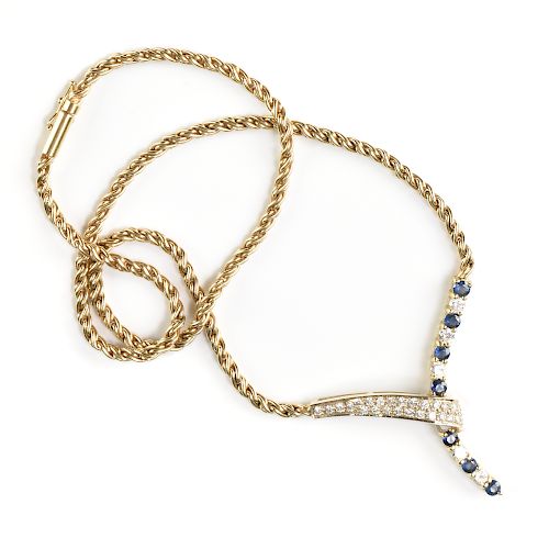 AN 18K YELLOW AND WHITE GOLD,