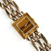 AN 18K YELLOW GOLD AND TIGER'S