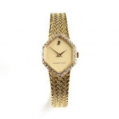 AN 18K YELLOW GOLD AND DIAMOND