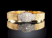 AN 18K YELLOW GOLD AND DIAMOND