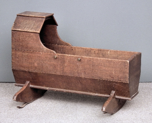 An 18th Century child's oak rocking
