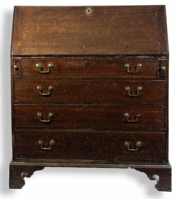 An 18th Century oak bureau the fall