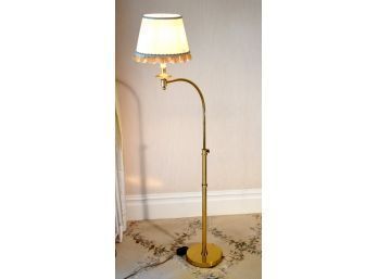An adjustable curved brass floor