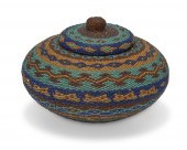 AN AFRICAN BEADED BASKETAn Afr