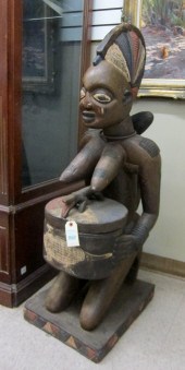 AN AFRICAN CARVED AND PAINTED
