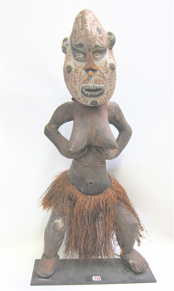 AN AFRICAN CARVED WOOD FEMALE