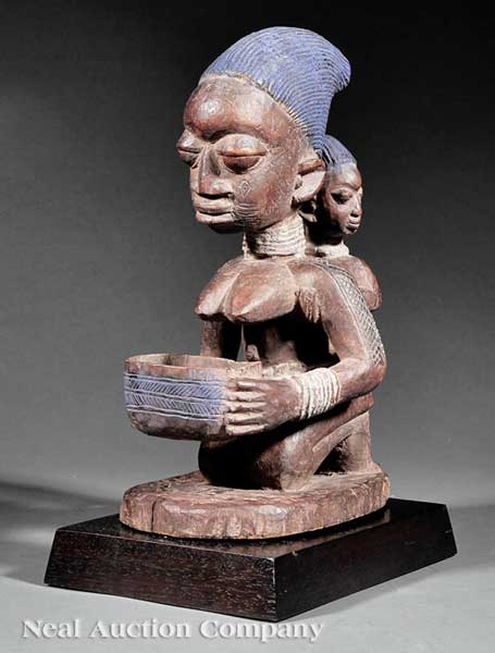 An African Carved Wood Figural
