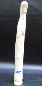 AN AFRICAN IVORY CARVED FIGURE