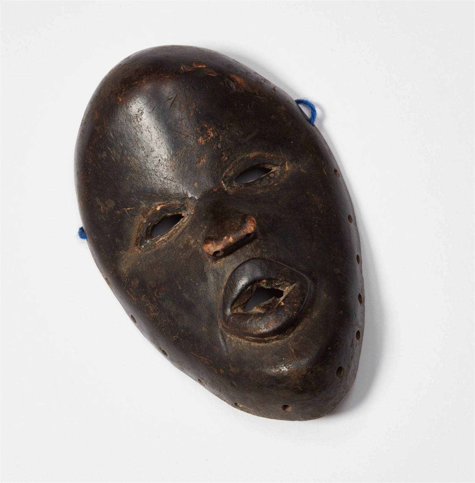 AN AFRICAN TRIBAL EBONIZED CARVED