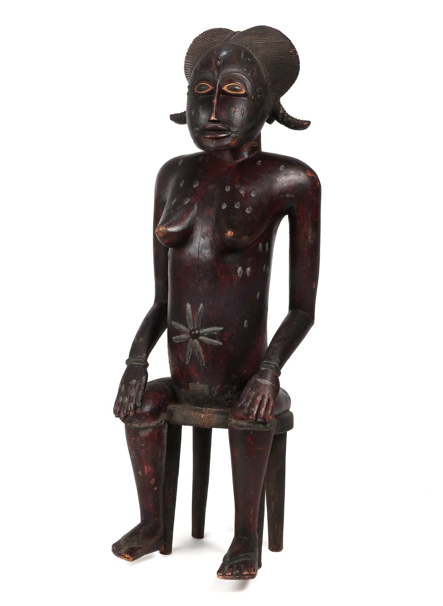 AN AFRICAN TRIBAL WOOD SEATED