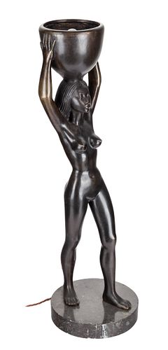 AN AFRICAN WATER CARRIER LAMPthe