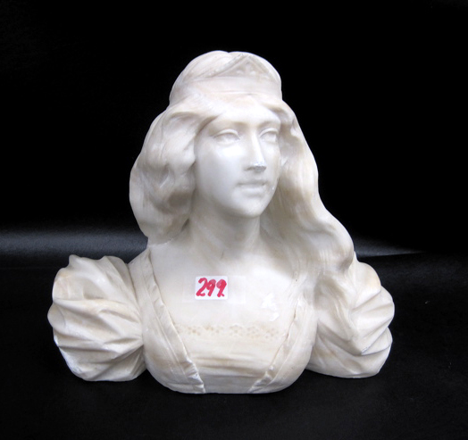 AN ALABASTER SCULPTURE of a young