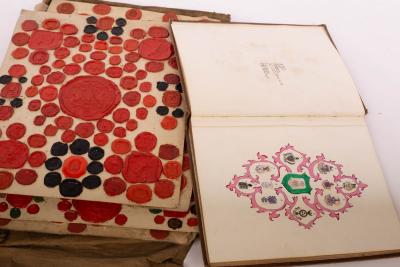 An album of crests, many mounted on