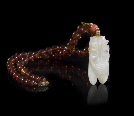 An Amber Bead Necklace with a White