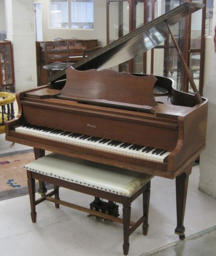AN AMERICAN BABY GRAND PIANO WITH