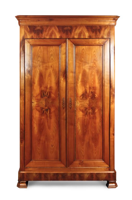 An American Cherry Armoire having a