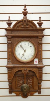 AN AMERICAN OAK CASED WALL CLO